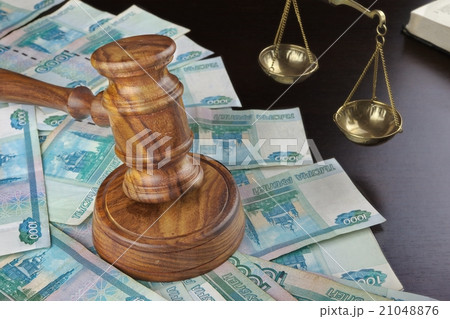 Judges Gavel,  Scale, Old Book And Cash On Table 21048876