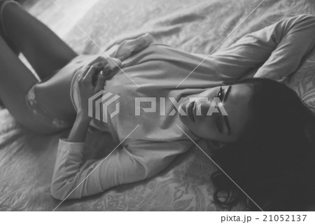 Sexy young woman in lingerie posing on the bed 21052137