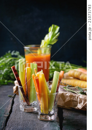Colorful carrots and juice Colorful carrots and juice 21073783