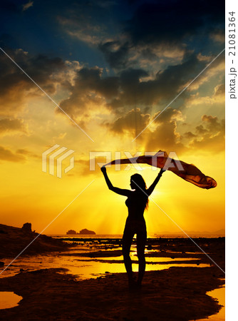 Happy Woman Posting in Sea Sunset Happy Woman Posting in Sea Sunset 21081364