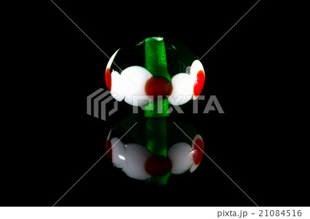 Transparent green and red glassy bead Transparent green and red glassy bead 21084516