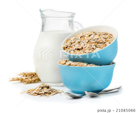 muesli in blue masks and milk jug isolated  21085066
