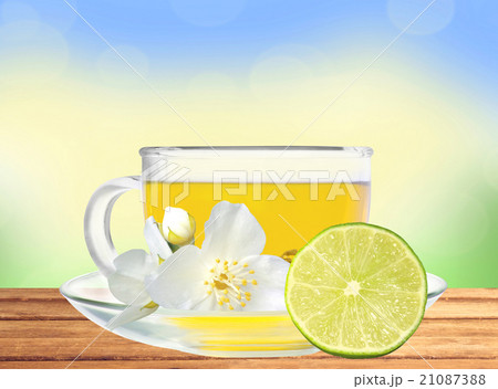 glass cup of tea with jasmine flowers and lime glass cup of tea with jasmine flowers and lime 21087388