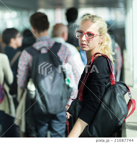 Young blond caucsian woman waiting in line. 21087744