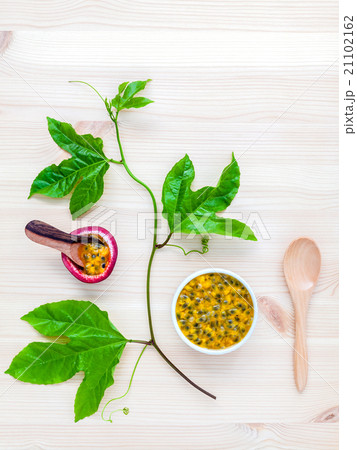Fresh passion fruits set up on wooden background. Fresh passion fruits set up on wooden background. 21102162