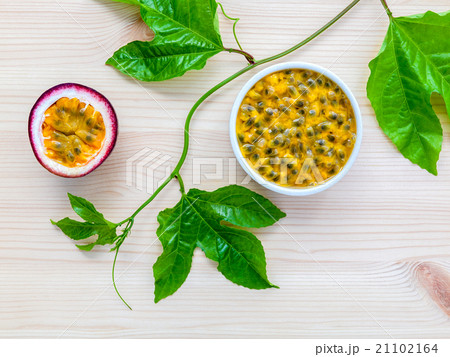 Fresh passion fruits set up on wooden background. 21102164