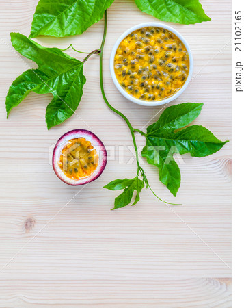Fresh passion fruits set up on wooden background. Fresh passion fruits set up on wooden background. 21102165
