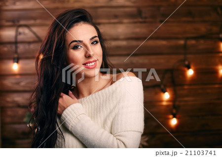 Portrait of gorgeous woman at home wooden 21103741