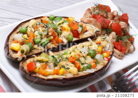 Half baked eggplants stuffed with vegetables 21108275