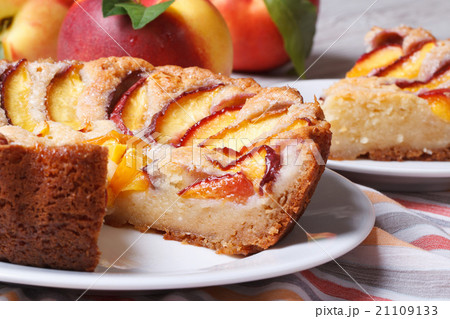 Cut peach pie on the table close-up. horizontal Cut peach pie on the table close-up. horizontal 21109133