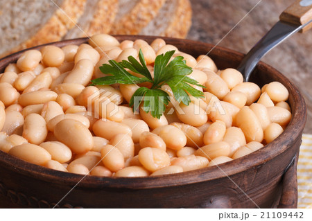 white kidney beans in a brown pot macro and bread white kidney beans in a brown pot macro and bread 21109442