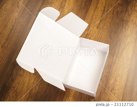 Blank white box mock up on wood background 21112710