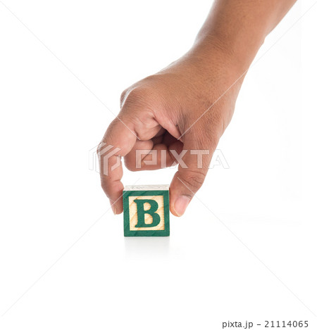 Hand holding colorful alphabet blocks "B" isolated on white Hand holding colorful alphabet blocks "B" isolated on white 21114065