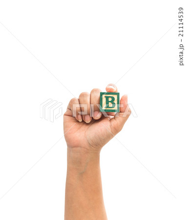 Hand holding colorful alphabet blocks "B" isolated on white 21114539