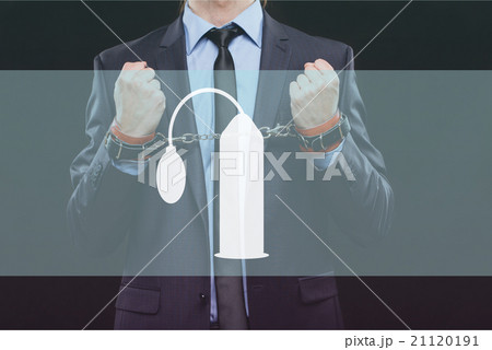 man in a business suit with chained hands man in a business suit with chained hands 21120191