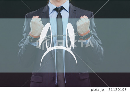 man in a business suit with chained hands man in a business suit with chained hands 21120193