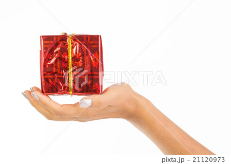 Woman's hand holding a red parcel Woman's hand holding a red parcel 21120973