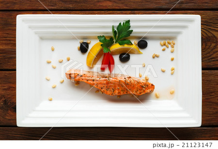 Restaurant food - grilled salmon with lemon. Restaurant food - grilled salmon with lemon. 21123147