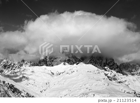 Black and white view on Mount Ushba in clouds 21123514