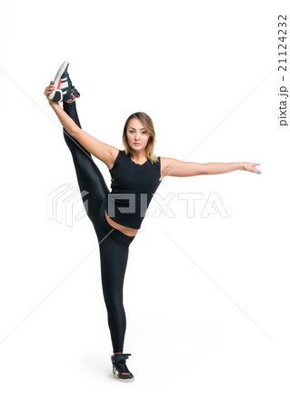 Young woman doing standing split isolated Young woman doing standing split isolated 21124232
