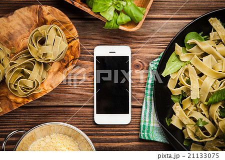 Cooked tagliatelle on a plate Cooked tagliatelle on a plate 21133075