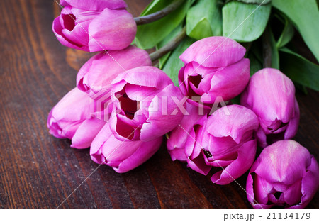 bouquet of colorful tulips on rustic wooden board 21134179