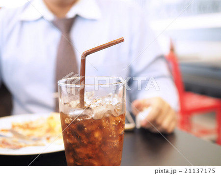 Unhealthy man having soft drink and junk food 21137175