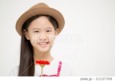 Portrait of little Asian child smiling with flower Portrait of little Asian child smiling with flower 21137709