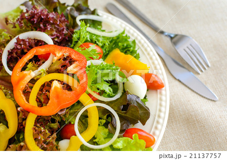 Close up of fresh salad on sackcloth Close up of fresh salad on sackcloth 21137757