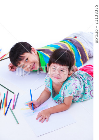 Children looking at the camera and smiling. 21138355