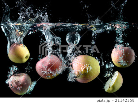 apples droping in to the clear water apples droping in to the clear water 21142359