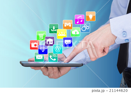 Businessman holding a tablet pc with mobile Businessman holding a tablet pc with mobile 21144620