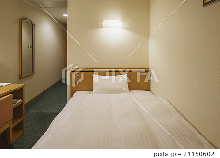 ビジネスホテル ベッドの写真素材