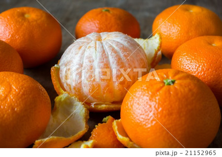 mandarins lie on a wooden table 21152965