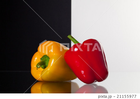 Two peppers on black and white background 21155977
