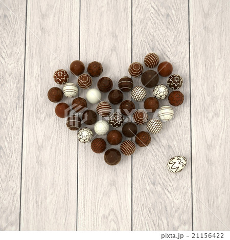 Chocolate Easter eggs heart on white wood 21156422