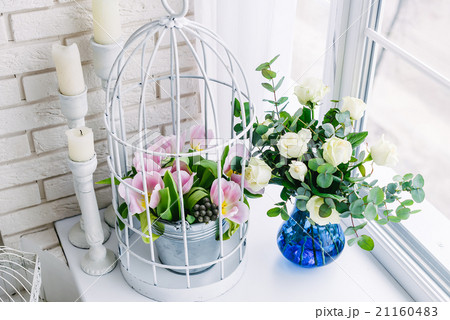 Flowers on the windowsill in studio 21160483