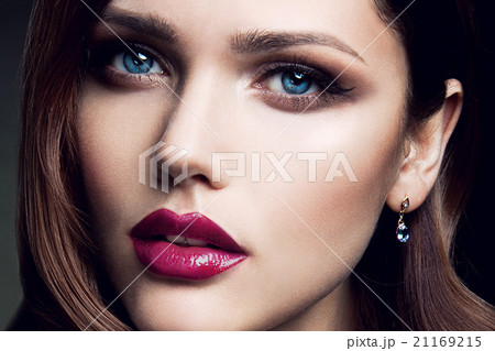 Portrait of beautiful girl with red lips. 21169215