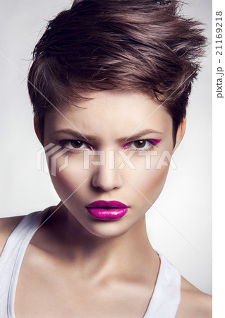 Portrait of beautiful girl with red lips. 21169218