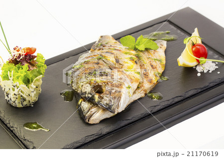 Fried fish dorado with vegetables and lemon Fried fish dorado with vegetables and lemon 21170619