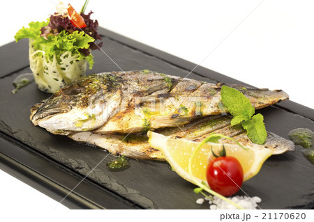 Fried fish dorado with vegetables and lemon Fried fish dorado with vegetables and lemon 21170620