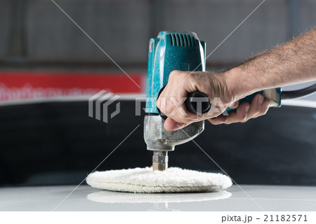 Car detailing series : Worker waxing white car 21182571
