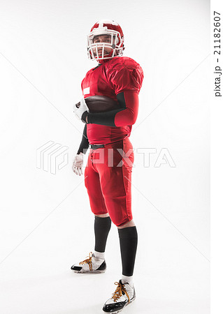 American football player posing with ball on white American football player posing with ball on white 21182607