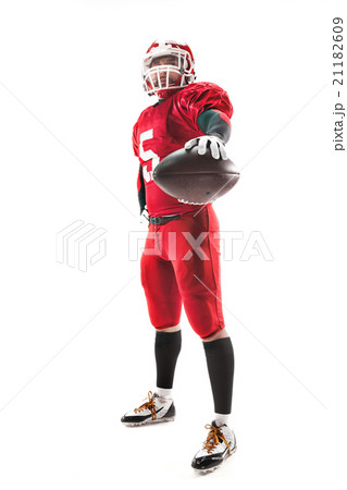 American football player posing with ball on white American football player posing with ball on white 21182609