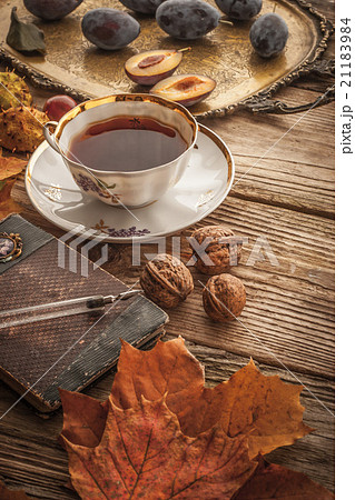 Cup of tea with gift and vintage notebook Cup of tea with gift and vintage notebook 21183984