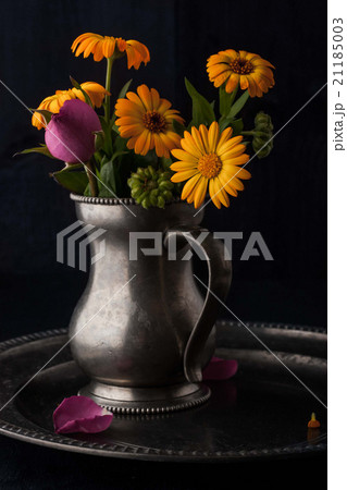 Bouquet of flowers in the old metal jug vertical Bouquet of flowers in the old metal jug vertical 21185003