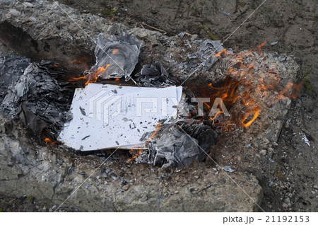 Burning office white paper in bonfire Burning office white paper in bonfire 21192153