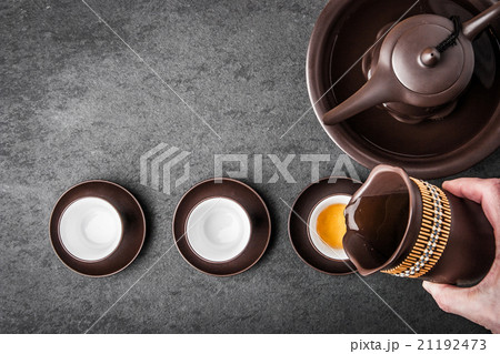 Kettle for tea ceremony on a gray stone table 21192473