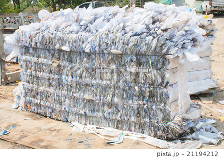 Plastic bottles pressed and packed for recycling 21194212