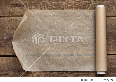 An open roll of paper on the wooden table の写真素材 [21194579] - PIXTA
